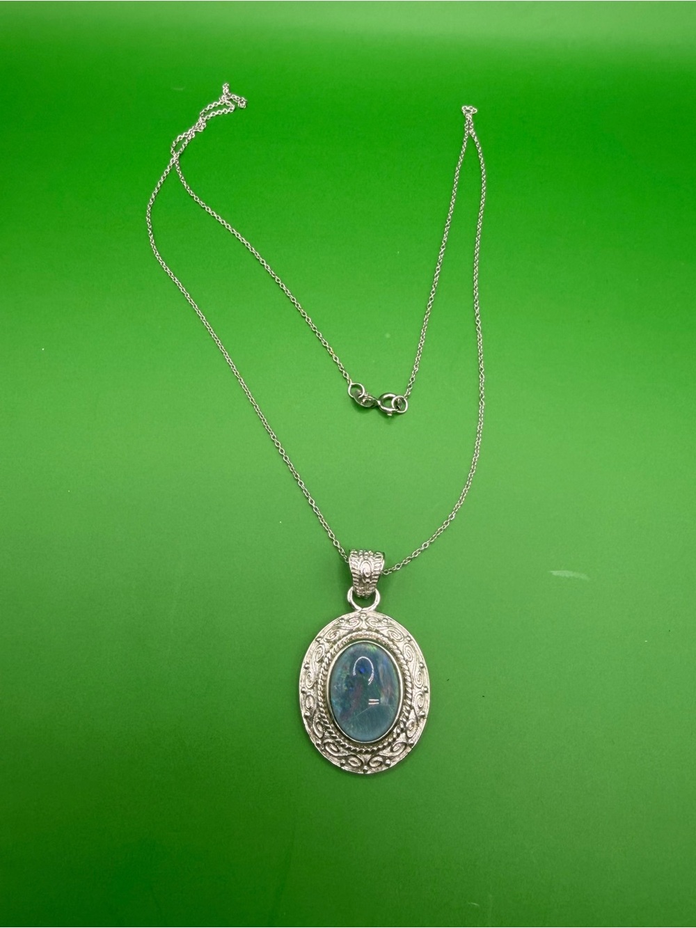 925 Sterling Silver Opal Pendant & 20” chain.
